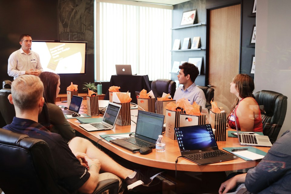 Corporate team reviewing weekly operational briefing